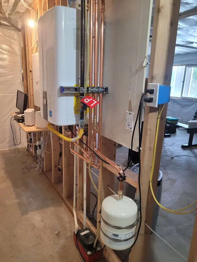 Licensed plumber repairing a kitchen sink in Isanti