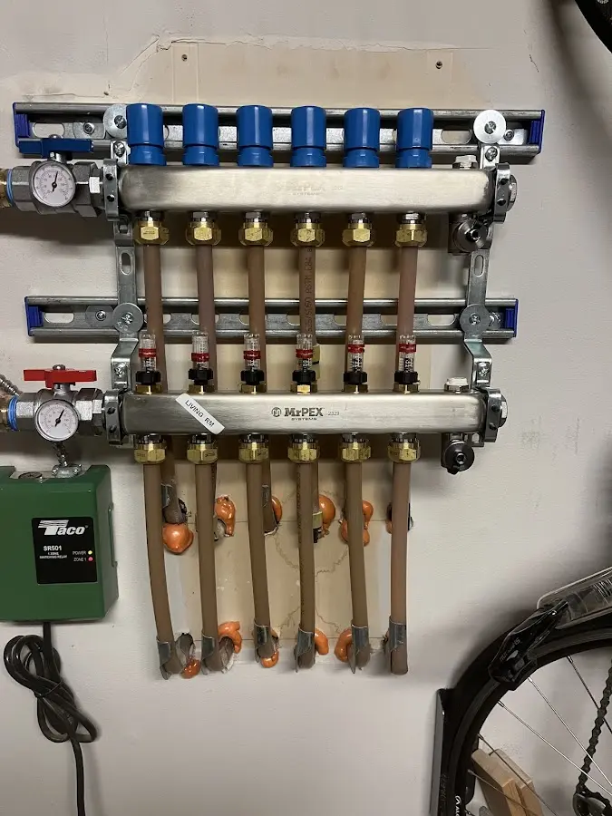 Plumber performing Water Heater Repair at a residential property in Isanti